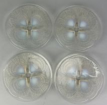 A SET OF FOUR RENE LALIQUE OPALESCENT 'COQUILLES' GLASS DISHES, 20cm in diameter each. Good