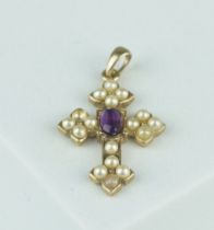 A 9CT GOLD PENDANT SET WITH AMETHYST AND SEED PEARLS, Weight: 1.8gms Cross 25mm x 20mm