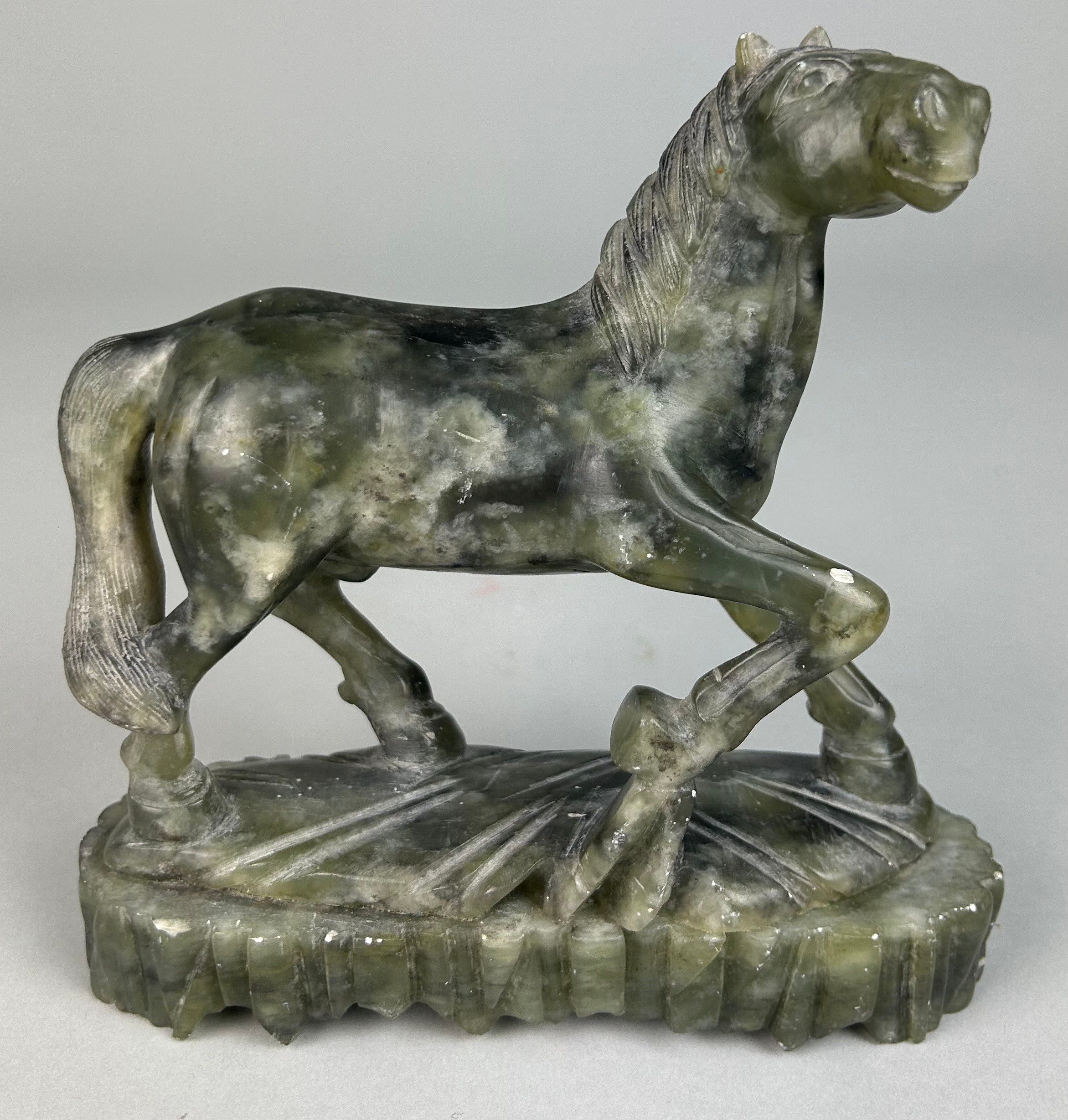 A CHINESE JADE COLOURED STONE FIGURE OF A HORSE, 16cm x 15cm