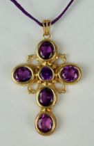 AN 18CT GOLD CROSS SET WITH SIX AMETHYSTS, Weight 31.8gms 6cm x 4.5cm