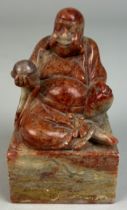 A CHINESE SOAPSTONE FIGURE OF A SEATED BUDDHA, 9cm x 5cm