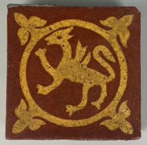 A VICTORIAN TILE CIRCA 1870 RED EARTHENWARE MOULDED AND INLAID WITH BUFF SLIP, By Godwin,