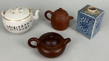 TWO CHINESE YIXING CLAY TEA POTS ALONG WITH A PORCELAIN TEAPOT DECORATED WITH FLOWERS AND BIRDS