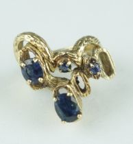 A TWO PIECE 1970'S 14CT GOLD RING SET WITH SAPPHIRES, Weight: 10.7gms The bark effect rings of