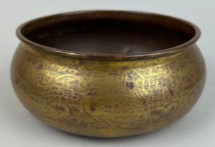 A LARGE GILT COPPER BOWL DECORATED WITH A LARGE DRAGON ON TRIPOD FEET, 16cm x 7cm