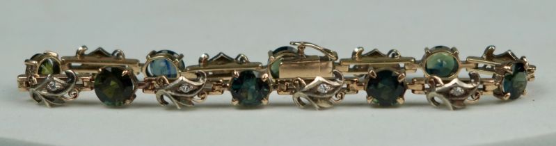 9CT GOLD DIAMOND BRACELET WITH GREEN STONES Weight: 9.5gms Length 180mm