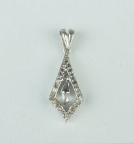 A BRIOLETTE CUT DIAMOND IN PENDANT SET WITH SMALL DIAMONDS, Weight: 1.2gms Pendant 19mm x 10mm
