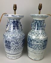 A VERY NEAR PAIR OF LATE 19TH OR EARLY 20TH CENTURY CHINESE BLUE AND WHITE VASES ADAPTED AS TABLE