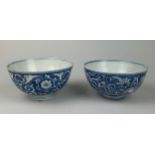 A PAIR OF MING DYNASTY CHINESE BLUE AND WHITE PORCELAIN BOWLS, 14cm x 7.5cm