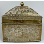 A 19TH CENTURY BRASS CASKET POSSIBLY INDIAN OR KHAJAR DECORATED WITH PEACOCKS AND FOLIAGE, 17cm x