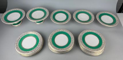 A SET OF SIXTEEN 19TH CENTURY PORCELAIN PLATES AND FIVE CAKE STANDS (16) Decorated with green and