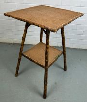 A TIGER BAMBOO OCCASIONAL TABLE WITH TWO TIERS,
