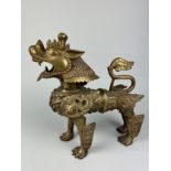 A LARGE 19TH OR 20TH CENTURY BRONZE FIGURE OF A LION, 30cm x 30cm x 10cm