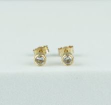 A PAIR OF SMALL DIAMOND EARRINGS IN 9CT GOLD (2), Weight: 0.45gms