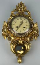 A WESTERSTRAND GILTWOOD CLOCK WITH KEY, In working condition. 54cm x 30cm