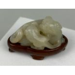 A 19TH CENTURY CHINESE JADE GROUP OF A LION WITH A CUB, 5.2cm x 3.2cm x 2.5cm
