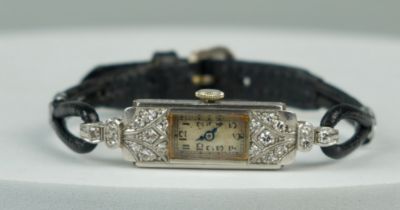 A PLATINUM LADIES COCKTAIL WATCH SET WITH SMALL DIAMONDS IN AN ASPREY AND CO BOX, Total weight: 12.