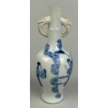 A SMALL KANGXI PERIOD CHINESE BLUE AND WHITE BOTTLE VASE WITH BISCUIT ELEPHANT HEAD HANDLES, 16cm