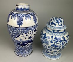 TWO BLUE AND WHITE VASES, One with damage. Largest 40cm H