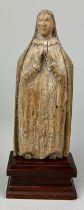 A RELIGIOUS WOODEN CARVING OF THE VIRGIN MARY, 16cm x 6cm Mounted on a later wooden stand.