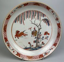 A 19TH CENTURY CHINESE PLATE DECORATED WITH A HORSE AND FLOWERS, 22cm diameter.