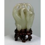 A 19TH CENTURY CHINESE WHITE JADE CARVING OF A BUDDHA’S HAND CITRON, 5cm x 3.8cm