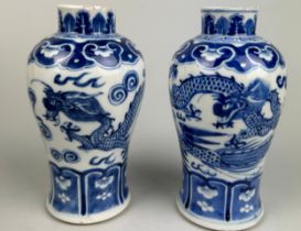 A PAIR OF 19TH CENTURY CHINESE BLUE AND WHITE JARS EACH DECORATED WITH A FOUR CLAWED DRAGON, 15cm