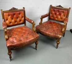 A PAIR OF 19TH CENTURY BUTTON BACK FAUTEUILS, Each upholstered in red or tan leather, raised on four