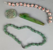 A COLLECTION OF CHINESE JADES AND BEADS (4)