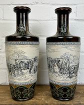 A PAIR OF VASES BY HANNAH BARLOW FOR DOULTON LAMBETH DEPICTING COWS AND SHEEP (2) 32cm H each.