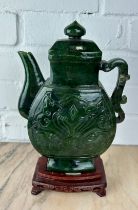 A LARGE CHINESE JADE OR JADEITE TEA POT AND COVER ON ROSEWOOD STAND, The jade teapot 25cm H