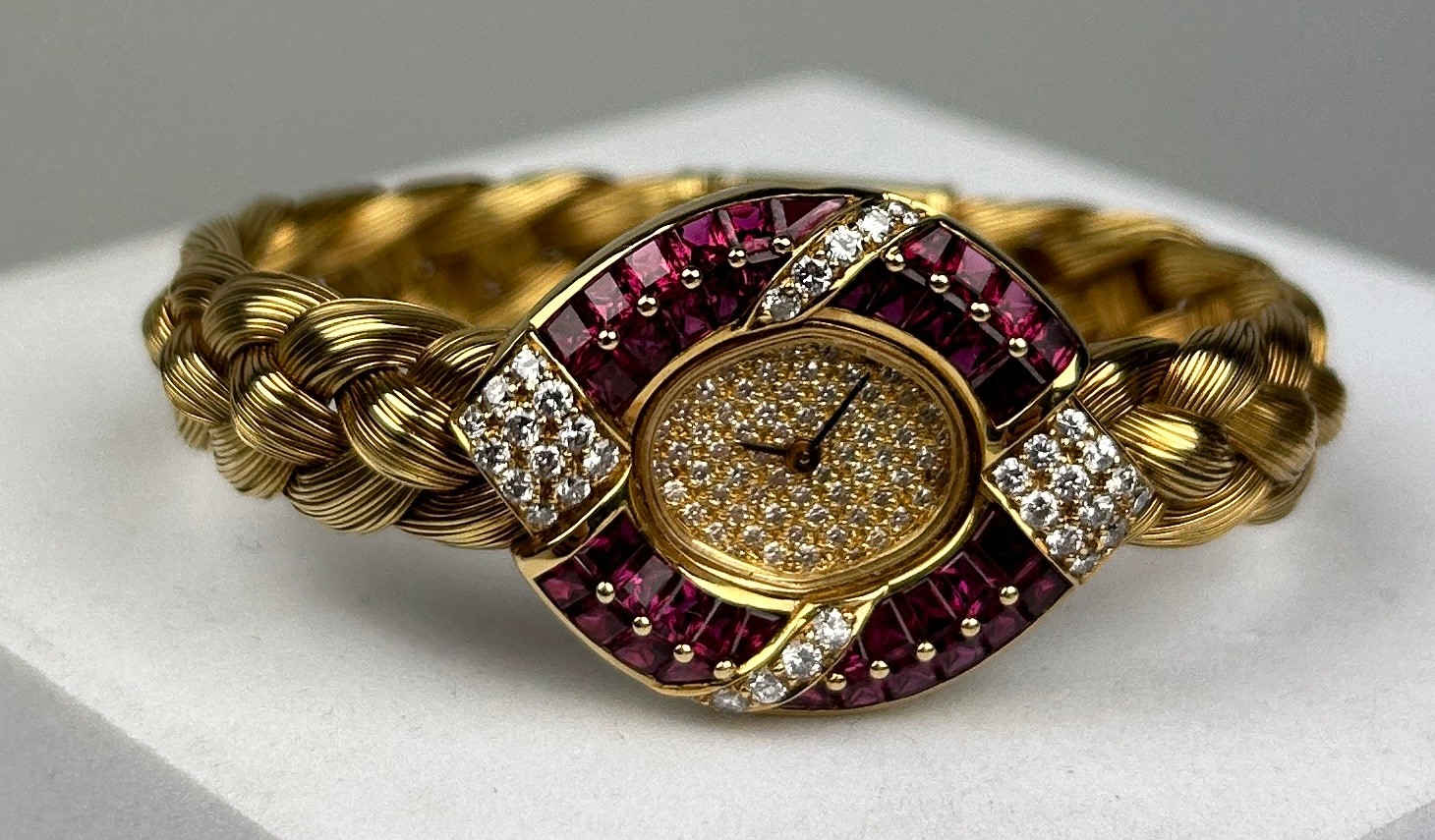 AN 18CT GOLD, RUBY AND DIAMOND SET LADIES WRISTWATCH, Weight 63.1gms