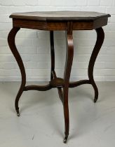 A 19TH CENTURY TWO TIERED OCTAGONAL OCCASIONAL TABLE ON FOUR CABRIOLE LEGS AND CASTORS WITH