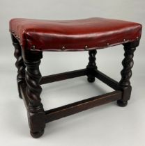 A CHARLES II STYLE FOOTSTOOL UPHOLSTERED IN RED STUDDED LEATHER, 41cm x 34cm x 30cm