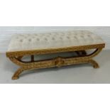 A MODERN EMPIRE STYLE FOOTSTOOL WITH CREAM UPHOLSTERED SEAT, 130cm x 50cm x 42cm
