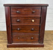 A 19TH CENTURY MAHOGANY MINIATURE WELLINGTON CABINET OR COLLECTORS CABINET WITH FOUR DRAWERS