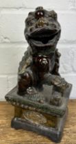 A CHINESE GLAZED POTTERY FIGURE OF A TEMPLE LION, Possibly 19th Century. 22cm H