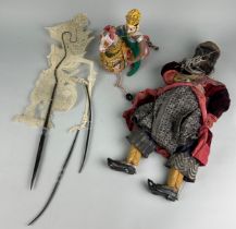 TWO SOUTHEAST ASIAN PUPPETS ALONG WITH AN INDIAN RIDER ON HORSEBACK, Largest: 53cm x 23cm