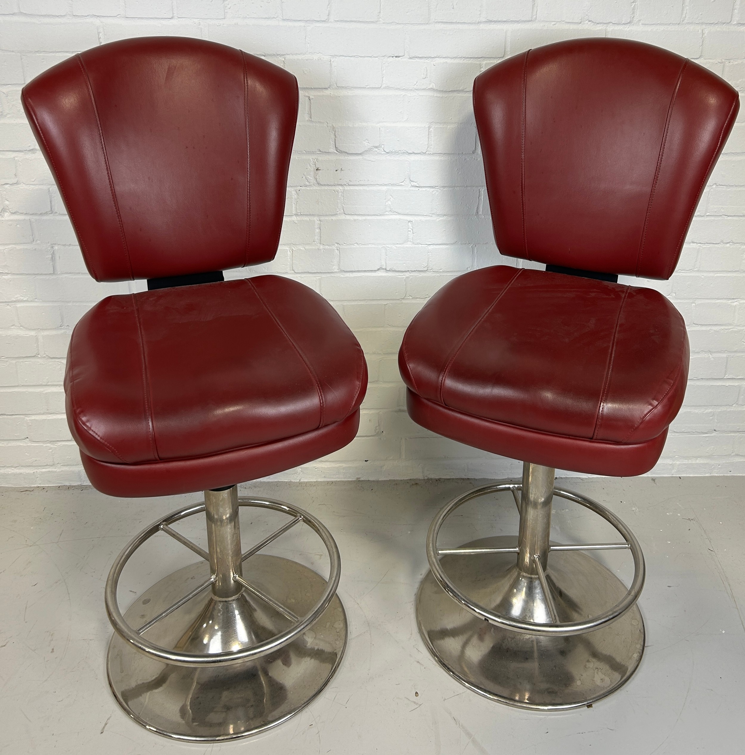 A PAIR OF POKER SWIVEL STOOLS UPHOLSTERED IN RED LEATHER WITH PICASSO STYLE FACES IN YELLOW TO BACKS - Image 2 of 2