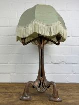 AN ART NOUVEAU CANDELABRA WITH FOUR PRICKET CANDLEHOLDERS AND GREEN SHADE,