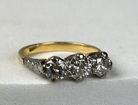 A THREE STONE DIAMOND RING IN 14CT GOLD, Weight 2.9gms