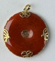 A LARGE CHINESE RED JADE PENDANT IN 14CT GOLD, Weight 13.4gms