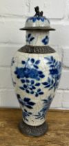 A CHINESE BLUE AND WHITE CRACKLE GLAZED VASE AND COVER