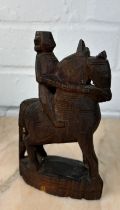 AN INDIAN WOODEN SCULPTURE OF A HORSE AND RIDER, 16cm x 9cm