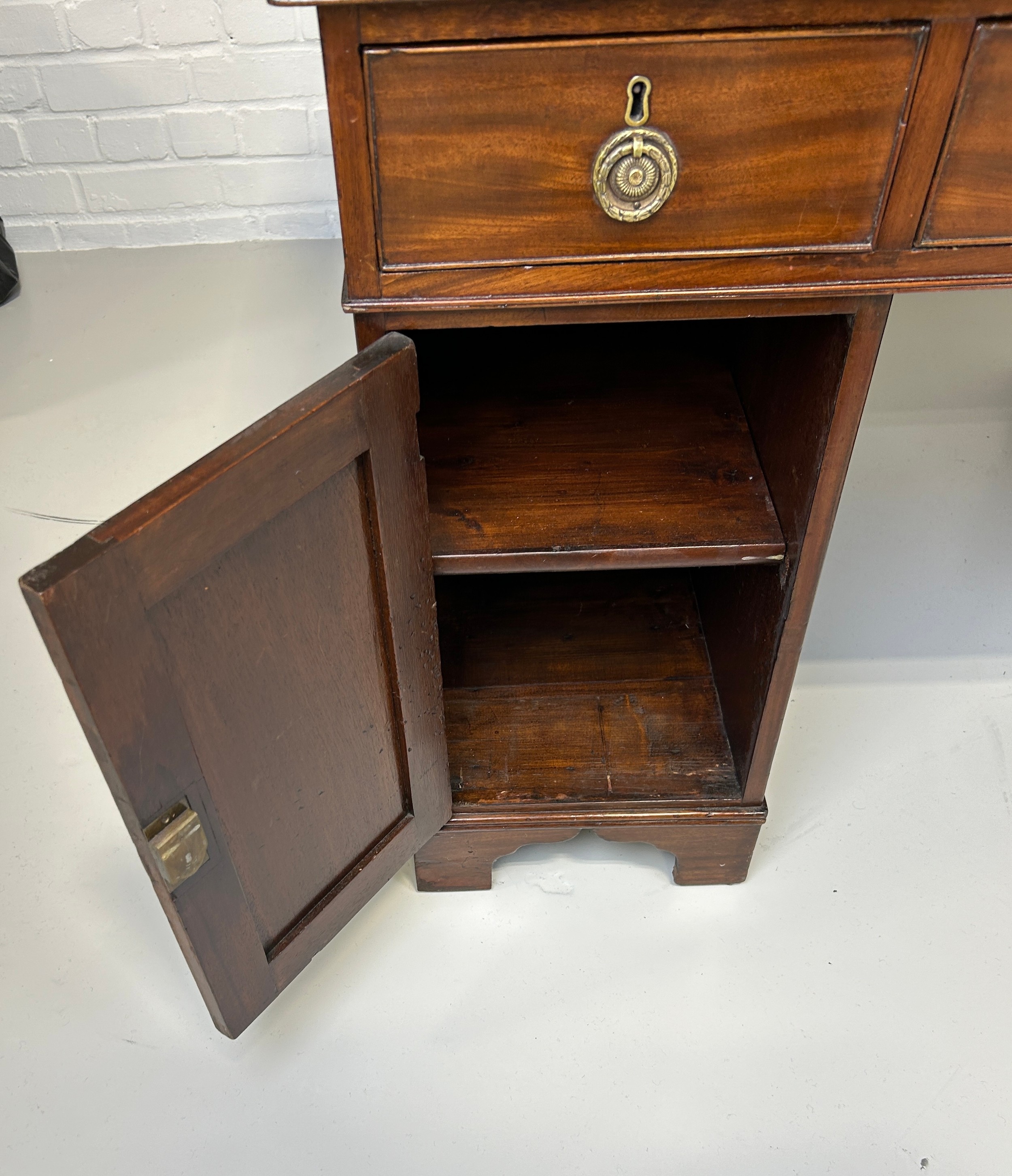 AN EARLY 19TH CENTRAL PARTNERS DESK, Two pedestals, each with ten drawers with brass handles. - Image 11 of 12