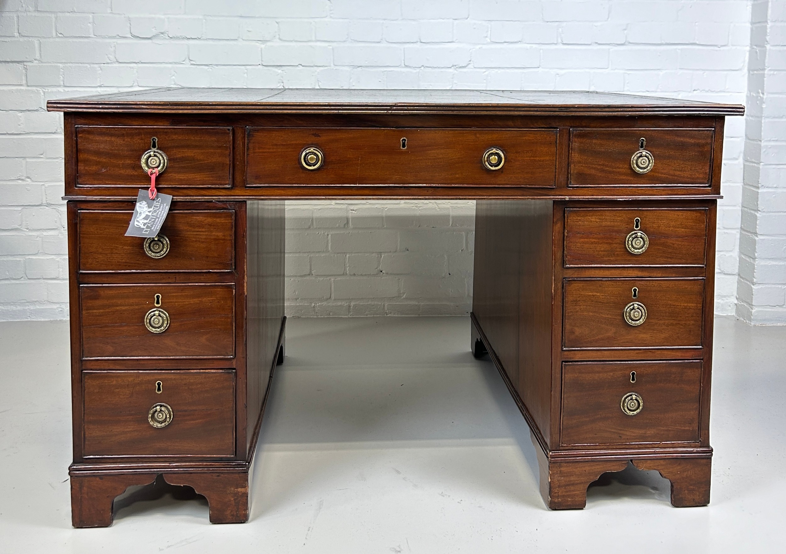 AN EARLY 19TH CENTRAL PARTNERS DESK, Two pedestals, each with ten drawers with brass handles. - Image 7 of 12