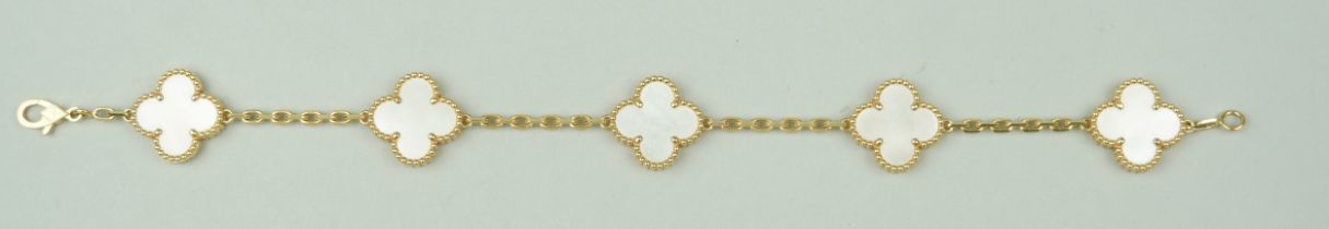 A VAN CLEEF AND ARPELS 18CT GOLD AND MOTHER OF PEARL FLORAL BRACELET, 19cm L