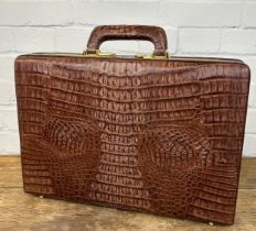 A CROCODILE SKIN BRIEFCASE BY PRESTO WITH GOLD COLOURED METAL HARDWARE, 45cm x 31cm x 8cm