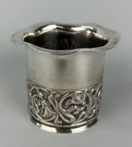 AN ARTS AND CRAFTS SILVER CUP DECORATED WITH REPOUSSE FLOWERS. Weight 107gms