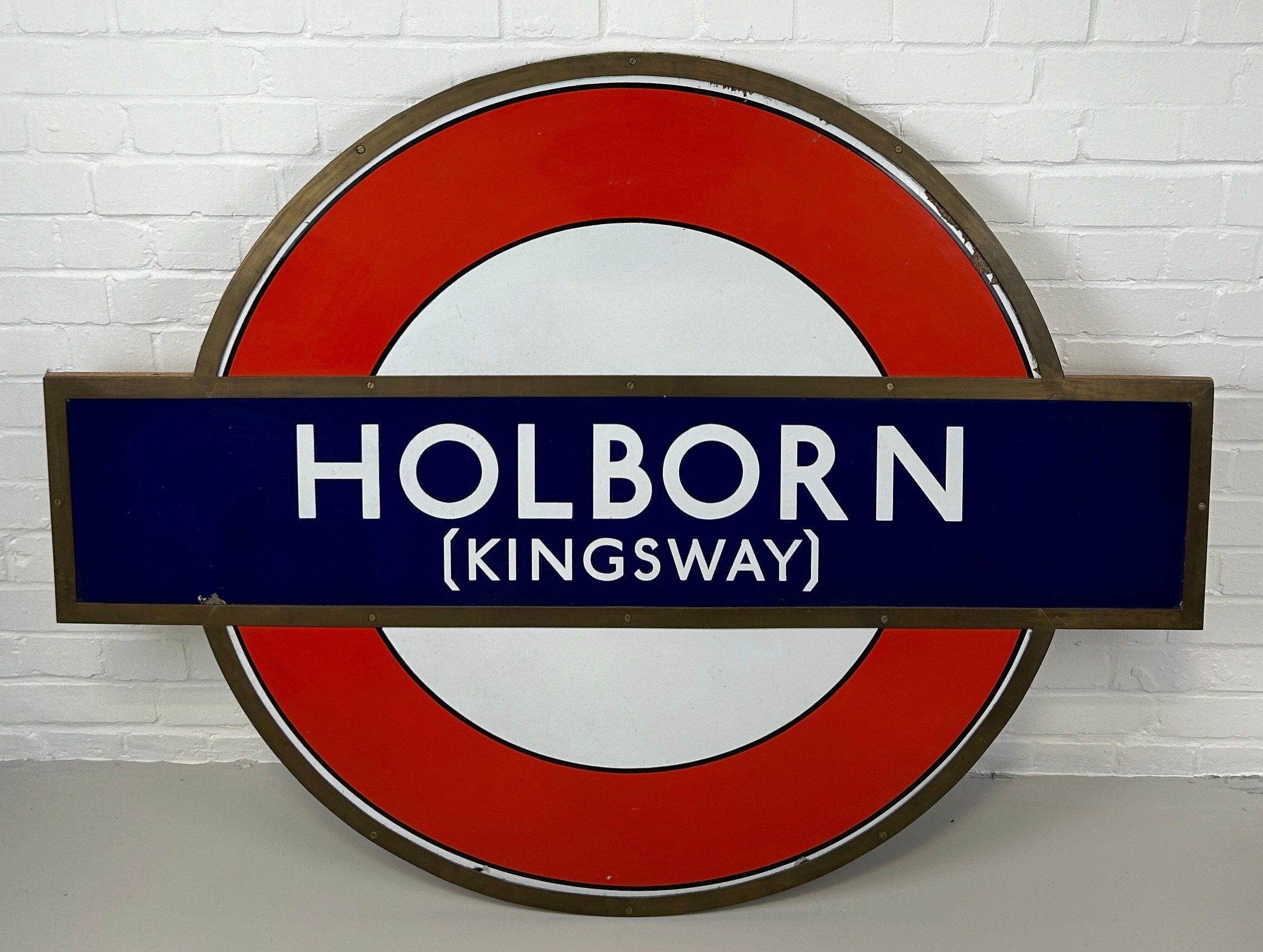 A LARGE LONDON UNDERGROUND RAILWAY SIGN FOR HOLBORN (KINGSWAY), With wooden board backing.